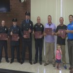 Good Samaritan, police officers honored for saving woman from sinking car