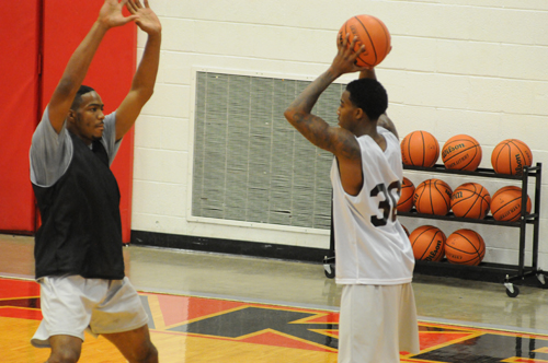 Returning sophomore Cortez Macklin (Louisville, Ky.), RIGHT, is guarded by freshman Eric Darrett (Nashville, Tenn.) during scrimmage play last week. Macklin was named a Division II Second-Team All-American in basketball by the National Junior College Athletic Association for his performance last year. Click on the image for a larger view. (ReAnne Palmer / RLC Public Information)