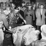 Rescue workers are pictured with one of the 119 miners killed on Dec. 21, 1951 in the Orient 2 explosion.