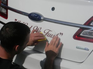 Cory Bolen, an employee of Sesser Auto Body, worked with painstaking care to install the decals.