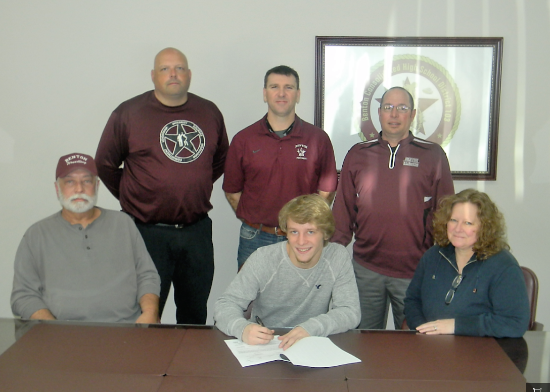 Benton's Peyton Smith signed a national letter-of-intent on Thursday to continue his wrestling career at Coker College, in Hartsville, South Carolina. Pictured at the signing are (seated) Smith's parents, Denny and Marya Smith and (back row l-r) Benton assistant wrestling coach Phil McMahon, Benton athletic director Ryan Miller and Benton head wrestling coach Duane Bean.