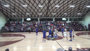 Anthnoy Darge jumping center to tip things off down at Cobden Friday night . In the picture is 24 Jared Payne, 35 Cory Wilce, 23 Tyson Kessler and 30 Jacob Dixon in blue. (Thompsonville Tigers youtube feed. 