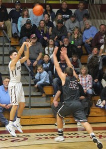 Benton's Austin Wills pulls up over S-V's Jamie Lance (Benton Gazette-Ian McMahon photo)