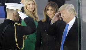 President-elect Donald Trump salutes as he arrives with his wife Melania Trump at a pre-Inaugural "Make America Great Again! Welcome Celebration" at the Lincoln Memorial in Washington, Thursday, Jan. 19, 2017. Watching is daughter Ivanka, second from left. (AP Photo/David J. Phillip)