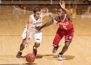 Saluki guard Mike Rodriguez drives around Bradley's Darrell Brown (SIU MEDIA SERVICES) 
