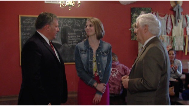 Rachel Rabe (center) with Founder and Guild CEO Tim Morthland (left) and President Glenn Poshard (Right) (WSIL Photo)