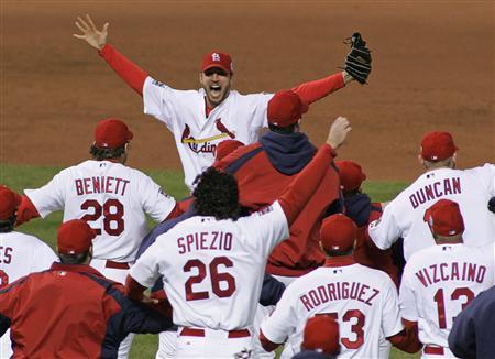 Five years later, Wainwright being mobbed by his Cardinal team mates after picking up the final out of the World Series.  (Reuters news service)